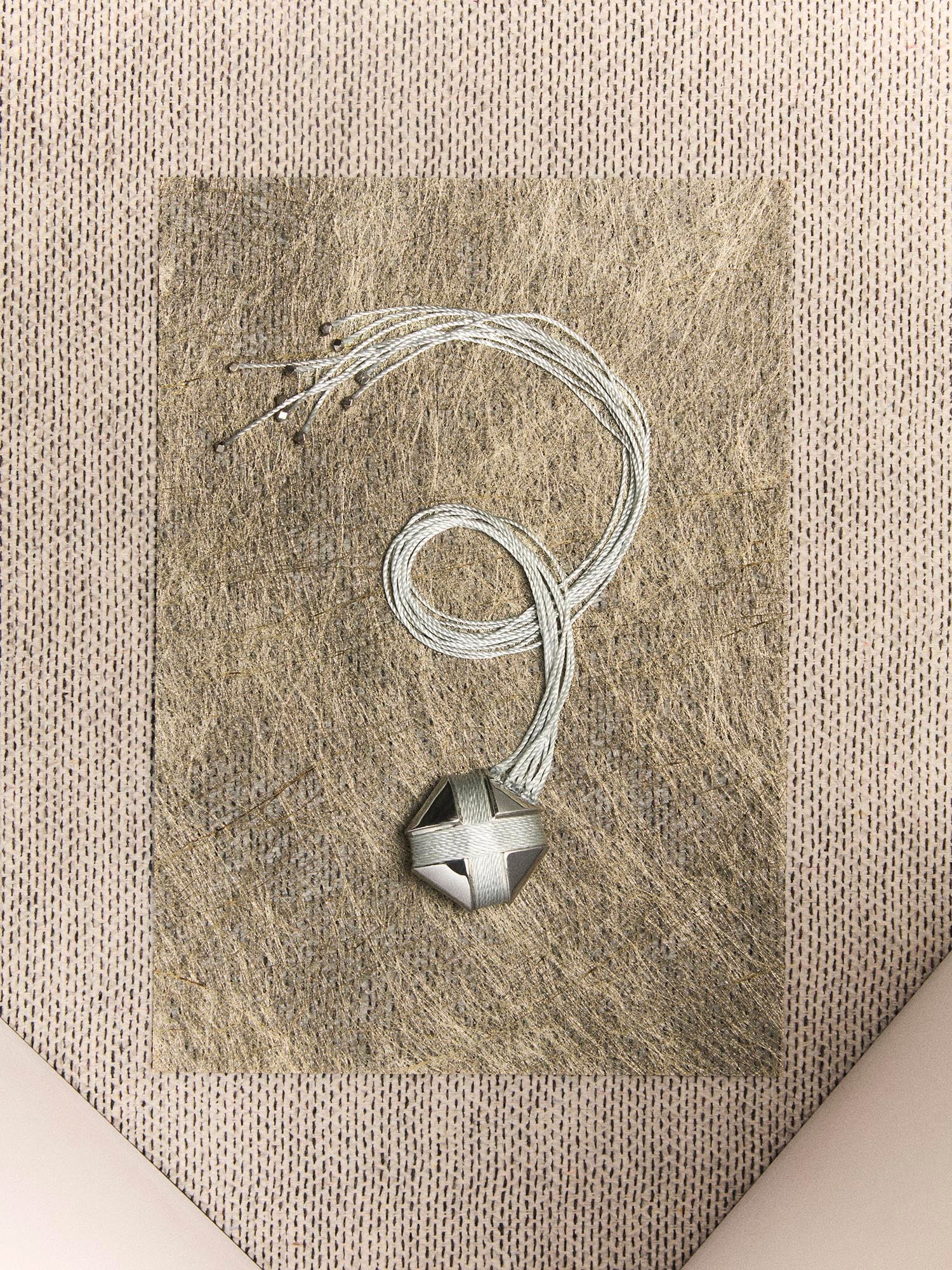 CURVED CROSS ROPE TASSEL BROOCH